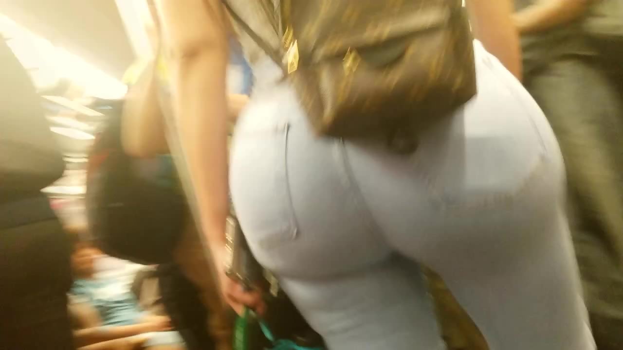 Huge butt in tight jeans spotted in a crowded train picture image