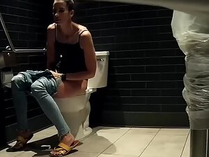 Spying on sexy tall girl peeing in public toilet