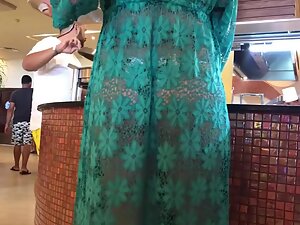 Sexy milf in transparent dress at a hotel breakfast